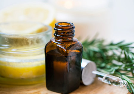 Rosemary essential oil bottle closeup with pipette, aromatherapy essential oil