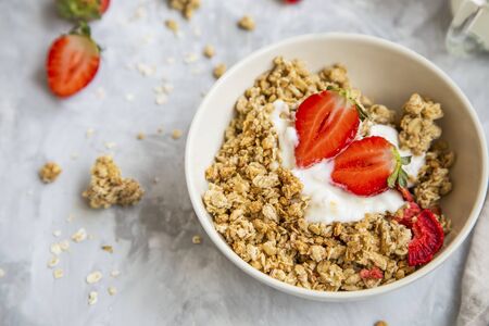 Muesli bowl with yogurt and strawberriesの写真素材