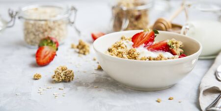 Muesli bowl with yogurt and strawberriesの写真素材