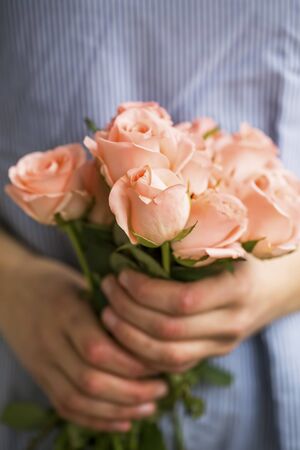 Roses bouquet,woman holding beautiful roses bouquetの写真素材