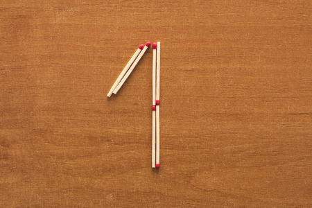 Number 1 on the wooden backgroundの写真素材