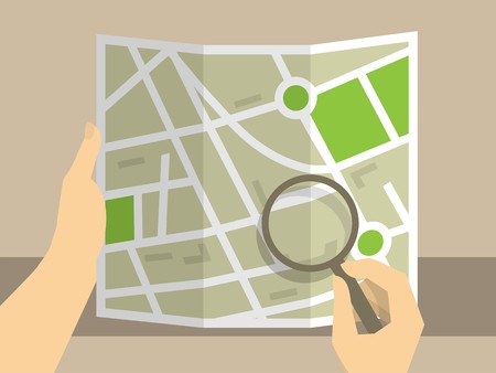 Human hands holding map for consideration use magnifying glassのイラスト素材