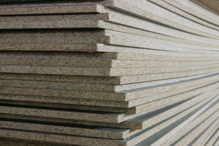 untreated chipboard slabs are stacked background imageの写真素材