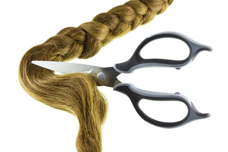 Women braid and scissors on a white backgroundの写真素材