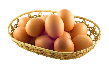 Brown eggs in the basket on white backgroundの写真素材