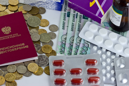 health care costs - pension on money background and pillsの写真素材