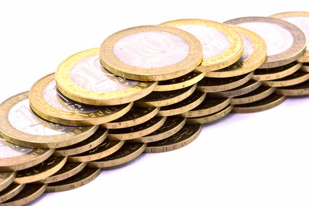 Line of  coins on a white background