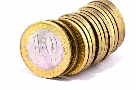 Line of  coins on a white backgroundの写真素材