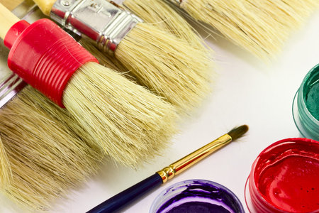 Close up of colorful paint and brushes