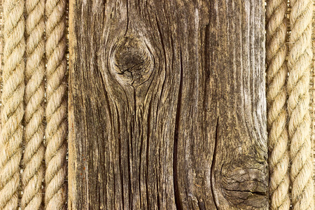 Old wooden board and a rope. Backgroundの写真素材