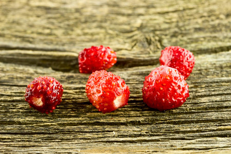 Strawberries on old wooden background