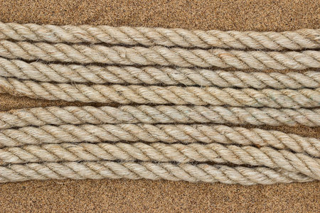  Jute rope on the sea sand. Backgroundの写真素材