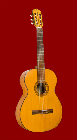 Classical guitar on a red backgroundの写真素材