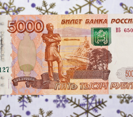 Russian 5000 ruble bank note on the background of snowflakesの写真素材