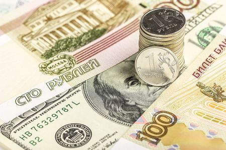 Russian rubles coins and dollars banknotes close up, as backgroundの写真素材