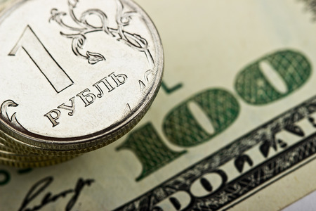 Russian ruble against the backdrop of the iron of the US dollarの写真素材