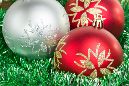 Christmas balls with tinsel as backgroundの写真素材