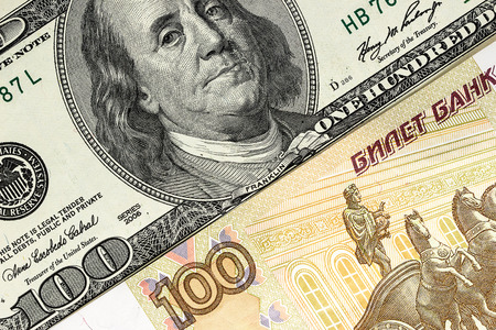 background of US dollars and Russian rublesの写真素材
