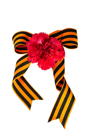 Carnation and bow of St. George Ribbon on a white backgroundの写真素材