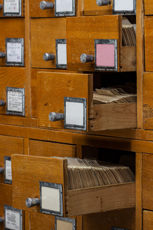 Open boxes in the old archive.  library card or file catalog.の写真素材