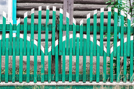 Wooden green fence. Can be used as backgroundの写真素材