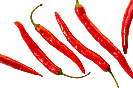 Red hot pepper isolated over white. with drops of water, top view