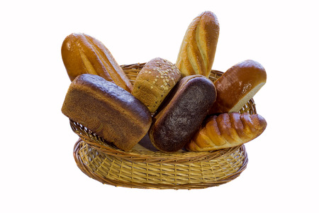 Composition with bread and rolls in wicker basket isolated on whiteの写真素材