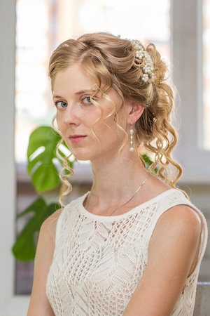 Young beautiful bride with beauty wedding hairstyle.