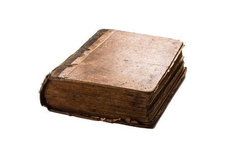 Very old book isolated on white. Texture of the old cracked cardboard cover of the bookの写真素材