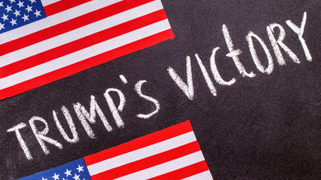 Trumps victory on the chalk board and US flag. Election conceptの写真素材