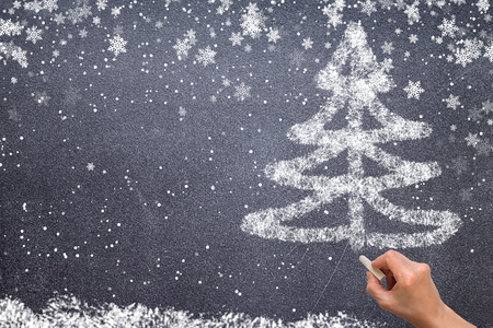 christmas tree drawing on blackboard with chalkの写真素材