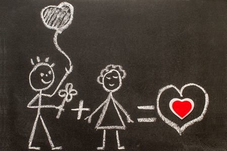 Boy and girl on chalkboard. Sweet love. Creative love. Valentine's Day Conceptの写真素材