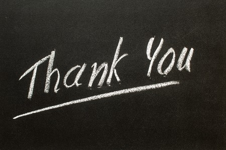 THANK YOU text written on  black chalkboardの写真素材