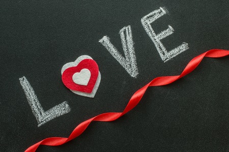 Love text written on chalkboard. Valentine's Day Conceptの写真素材