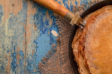 Stack of pancakes on frying pan, top viewの写真素材