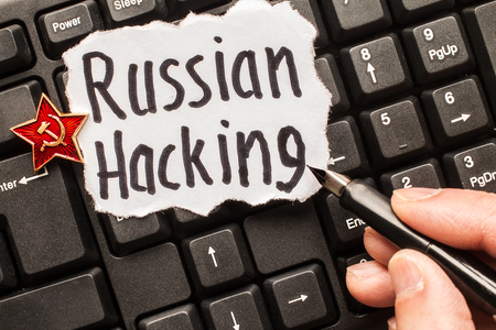 Russian hacking, inscription on torn  white paper  sheet. Russia hacking conceptの写真素材