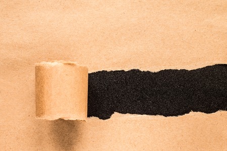 Vintage torn paper with space for text with black backgroundの写真素材