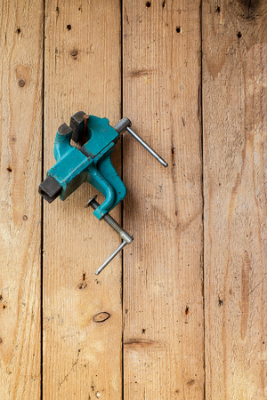 Old vise hanging on the wall. With copyspaceの写真素材