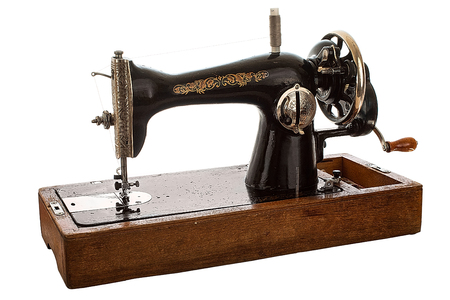 An old, hand sewing machine. Isolated, on white backgroundの写真素材