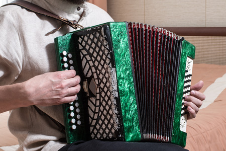 The musician playing the accordion.  man playing on a musical instrument
の写真素材