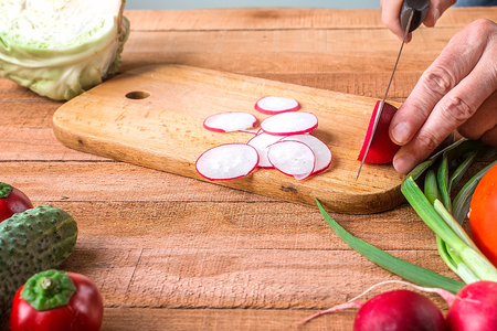 Cutting of garden radish for saladの写真素材
