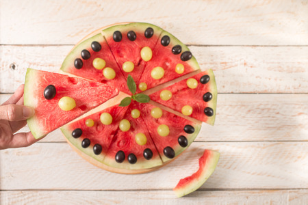 Slices of watermelon on wooden table. Top view,  Flat layの写真素材