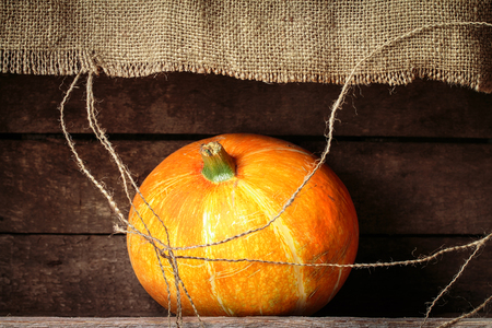Pumpkin  on a old wooden table. Healthy organic food. with copy spaceの写真素材