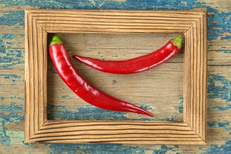  red hot pepper on rustic wooden background. culinary background. Top view with copy spaceの写真素材