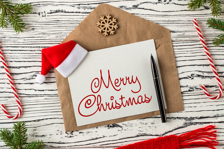 MERRY CHRISTMAS handwritten inscription. Winter holiday composition. New Year and Christmas celebration. Winter holidays concept. Christmas decorations. Top view,  Flat layの写真素材
