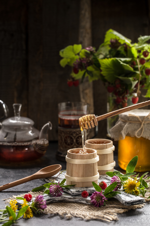 natural organic honey on a wooden table. Still lifeの写真素材