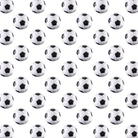 Seamless pattern of balls. Black and white soccer balls flying in the air, isolated on white background. Minimalistic concept of sportsの写真素材
