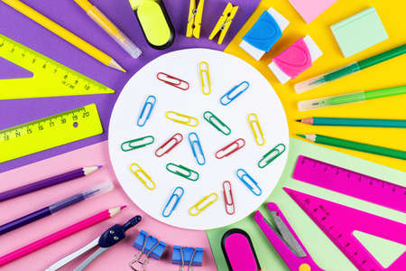 Back to school concept. various writing tools and other school stationary on colorful paper background. summer time, creativity and education concept. template for text or designの写真素材