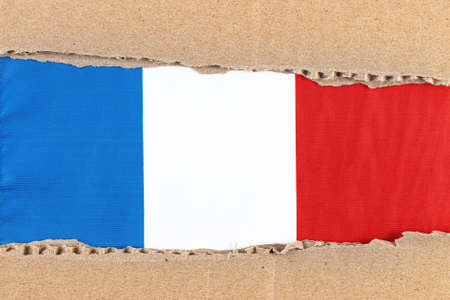 Torn paper with National Flag of France. Travel concept with French Flag.の写真素材