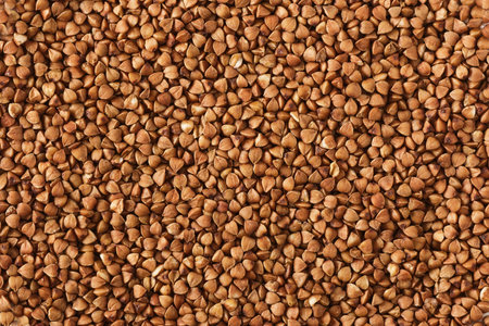 Buckwheat texture background. dry buckwheat background. Natural healty food, vegan diet. dry buckwheat. abstract food backgroundの写真素材